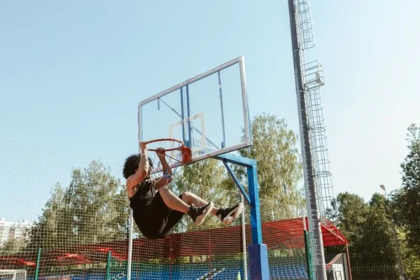 young basketball player dunking